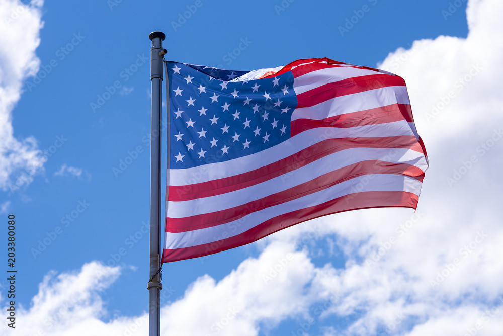 American Flag waving against blue Sky