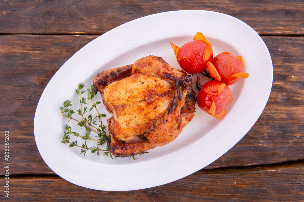 The quail fried with spices and tomatoes The quail fried with spices and tomatoes