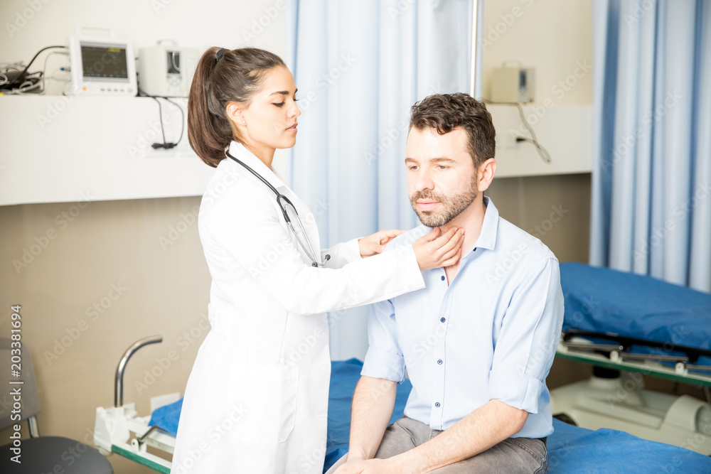 Man with throat infection visiting a doctor Man with throat infection visiting a doctor