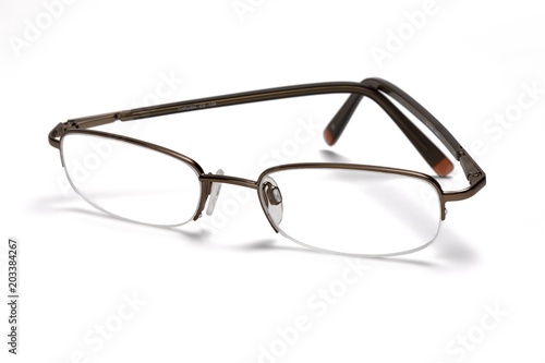 A pair of specticals on a white background, with a drop shadow.