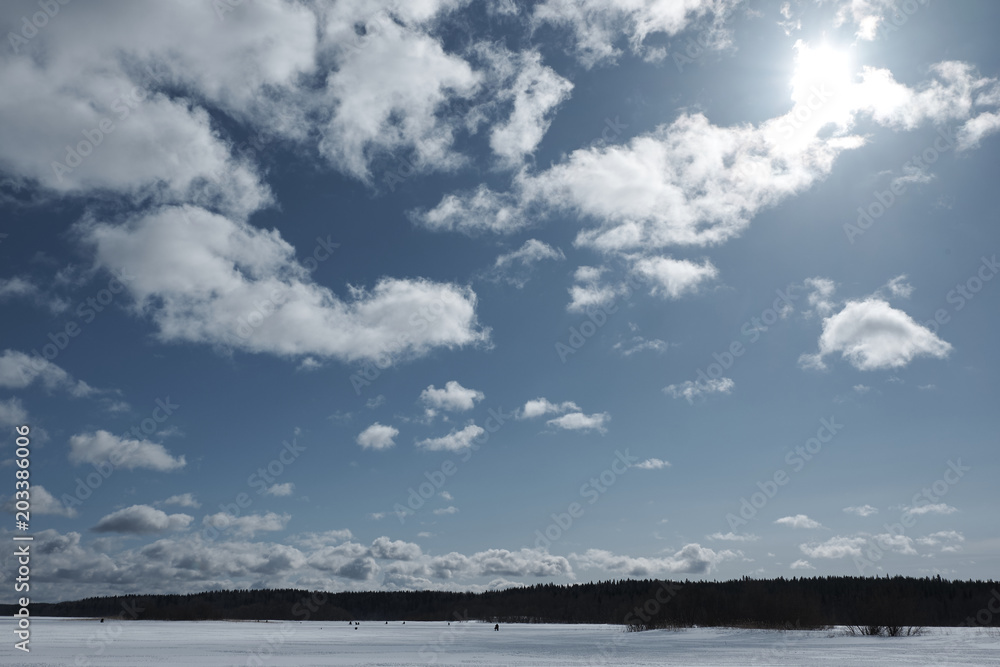 lake in winter, clouds in the sky, forest