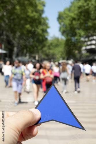 man with a blue arrow in Las Ramblas, Barcelona.