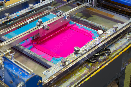 Serigraphy Printer ink machine pink magenta color photo