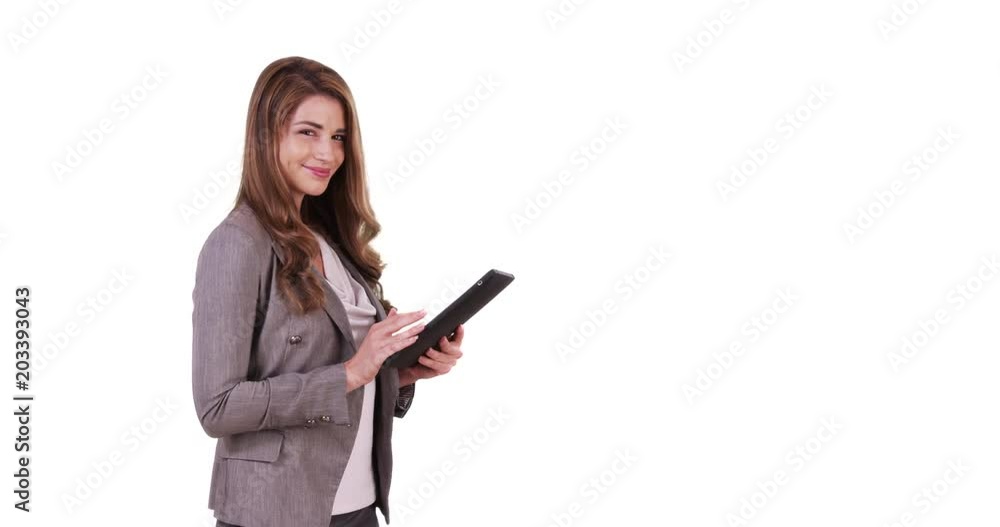 Portrait of good-looking white female using tablet device on white background Portrait of good-looking white female using tablet device on white background