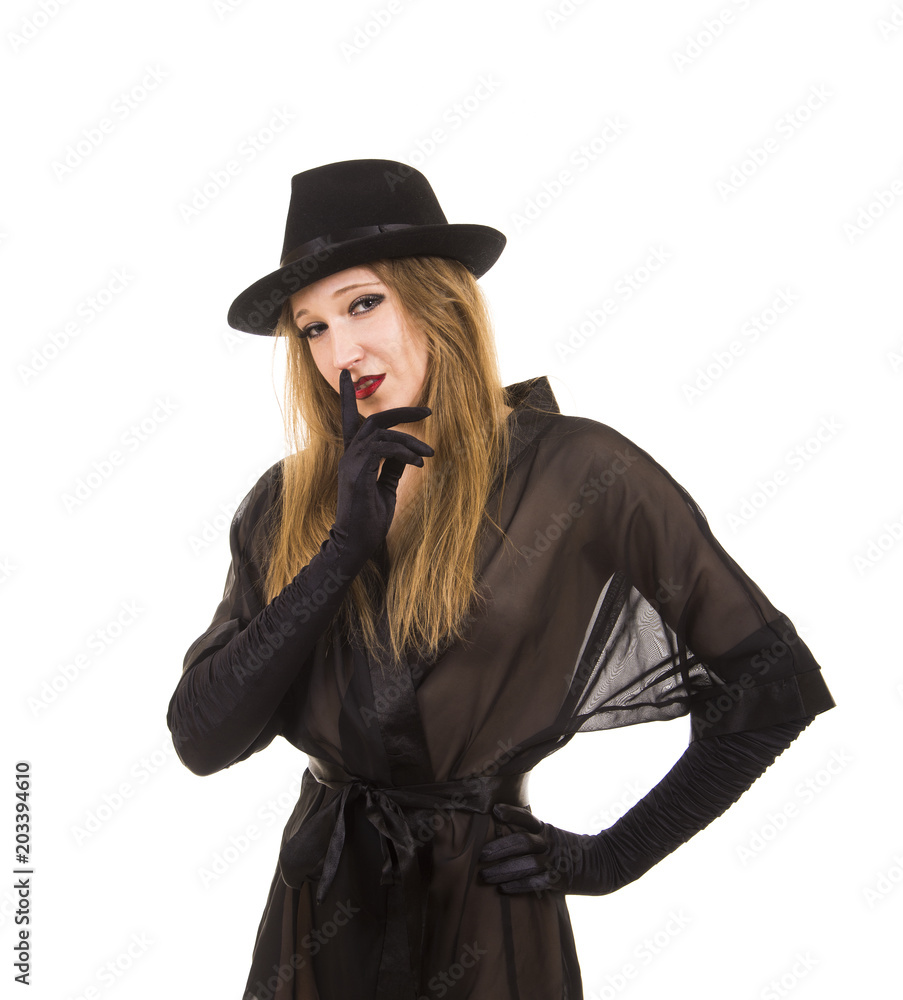 Beautiful young girl in black tunic, black hat and black gloves. Beautiful young girl in black tunic, black hat and black gloves.