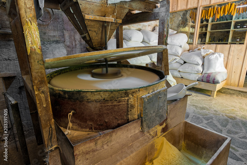 View of the interior of a traditional water mill producing corn flour in Greece