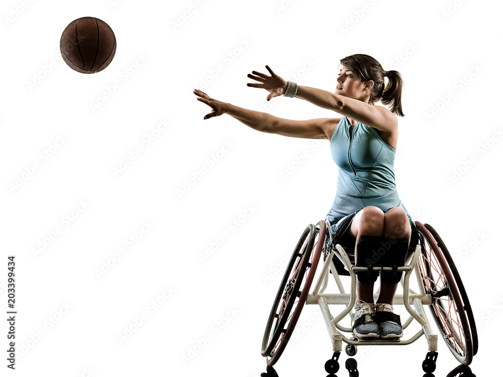 Naklejka premium one caucasian young handicapped basket ball player woman in wheelchair sport tudio in silhouette isolated on white background