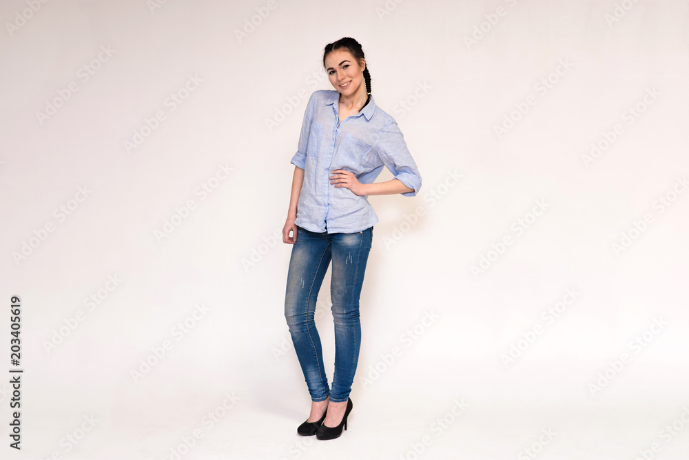 Portrait of a happy beautiful young brunette girl on a white background. Portrait of a happy beautiful young brunette girl on a white background.