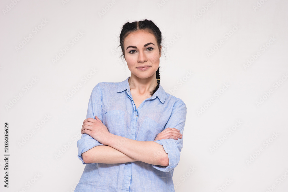 Portrait of a happy beautiful young brunette girl on a white background. Portrait of a happy beautiful young brunette girl on a white background.