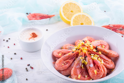 Boiled shrimps, are served with sauce from a curry, a lemon and spices