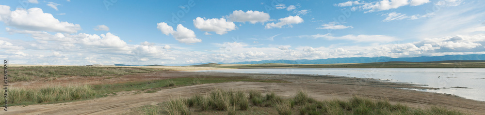 Panorama. Landscape of salt lake in the steppe. Tyva. Outdoors