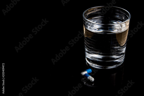 Medical pills isolated on a black background photo
