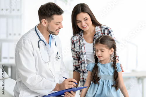 Woman with her daughter at ...