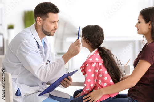 Woman with her daughter at ...