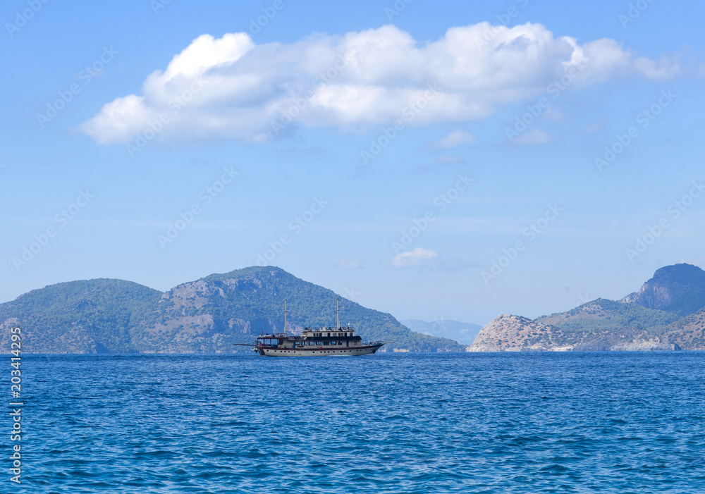 Boats over calm sea in blue lagoon in Turkey