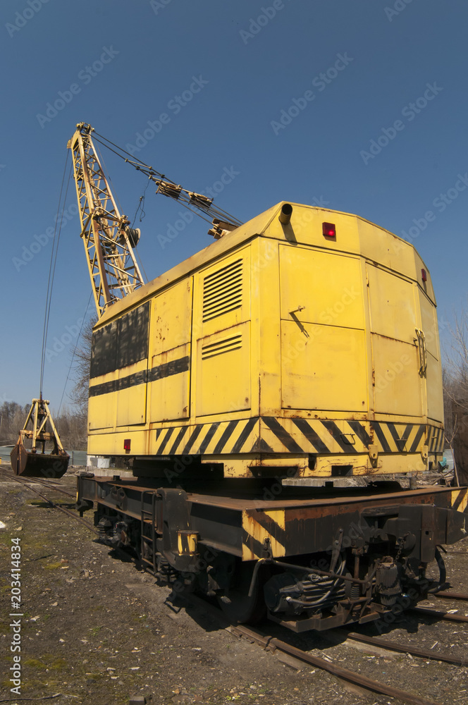 railway crane standing on the tracks