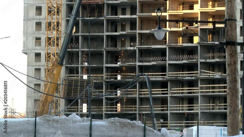 Crane working at a construction site view Crane working at a construction site view