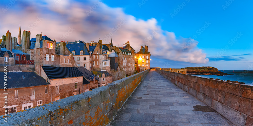 Night panoramic view of beautiful walled city Intra-Muros in Saint-Malo, also known as city corsaire, Brittany, France - obrazy, fototapety, plakaty 