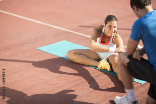Woman training with personal trainer