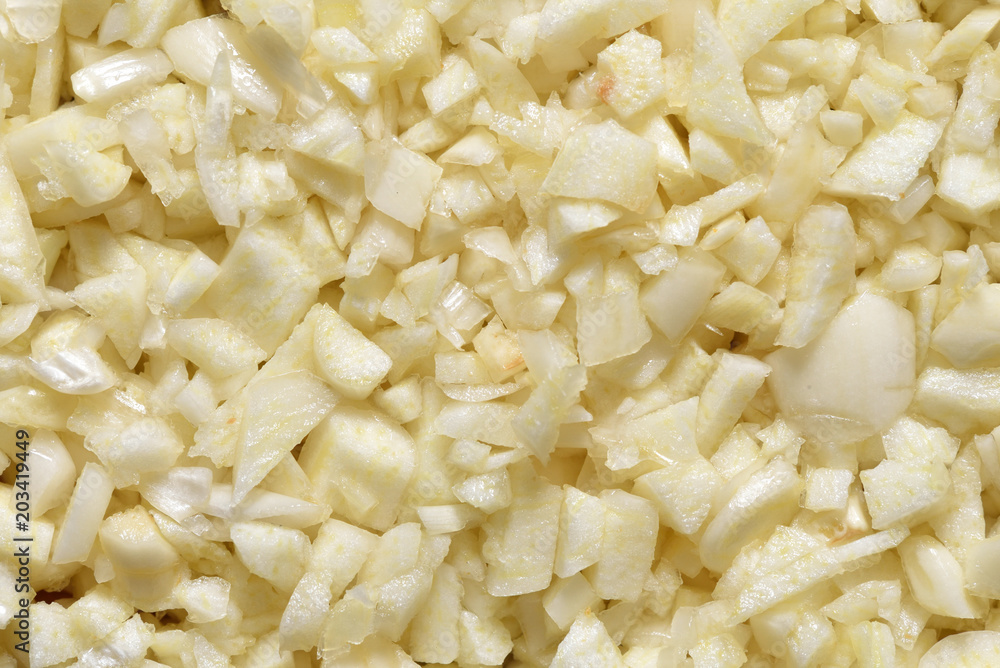 Finely chopped garlic. A lot of chopped garlic, texture and surface, close-up Finely chopped garlic. A lot of chopped garlic, texture and surface, close-up