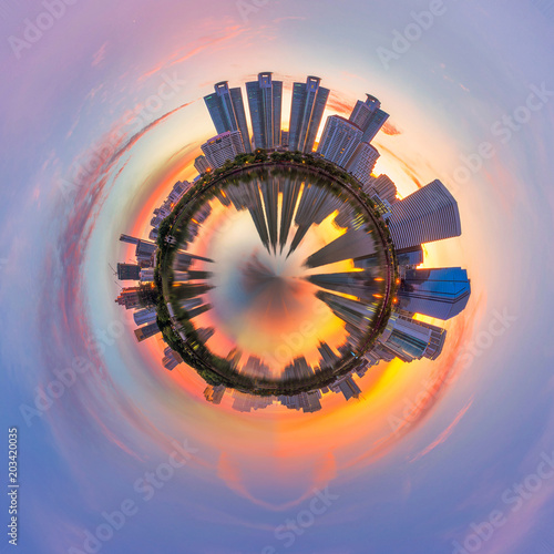 circle polar view of panorama skyscraper cityscape of high building in the city at morning view form the park with blue and red sky.