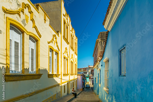 Colorful narrow street in Santiago de Cuba 