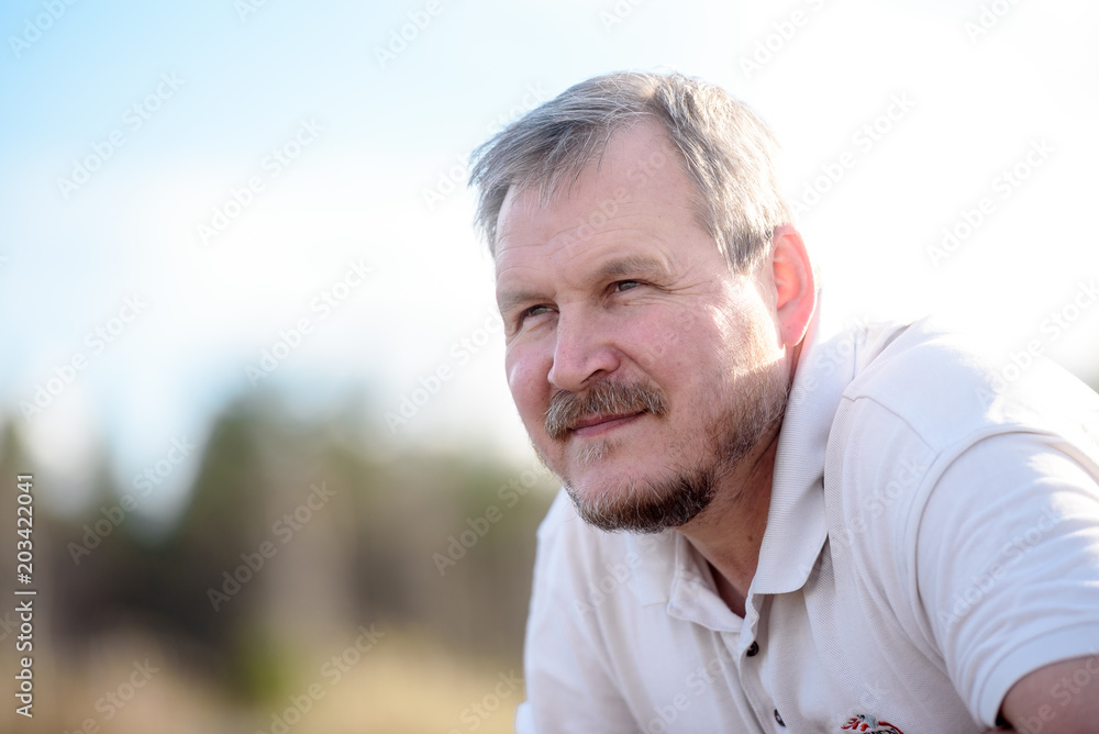 handsome man in nature smiles handsome man in nature smiles