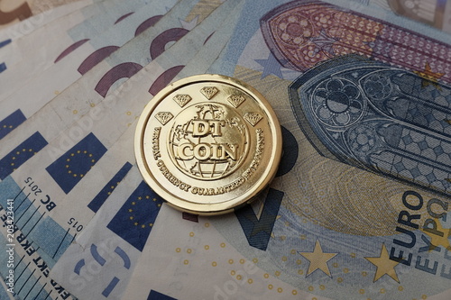 ditcoin coin on euro banknotes photo