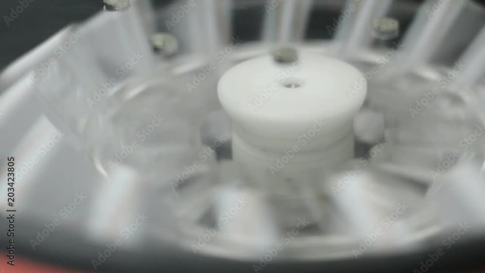 Scientist or doctor using blood centrifuge for testing in laboratory Scientist or doctor using blood centrifuge for testing in laboratory