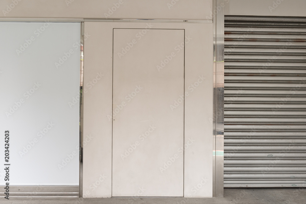 sidewalk by street wall & door sidewalk by street wall & door
