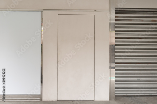 sidewalk by street wall   door