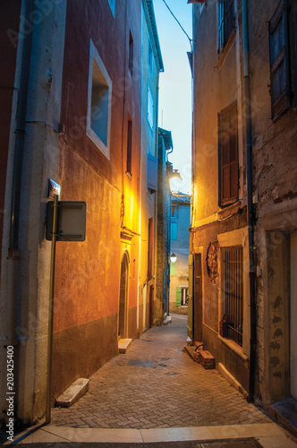 View of narrow alley in the early evening with lamp lit  in the lovely village of Rians. Located in Var department  Provence region  in southeastern France.