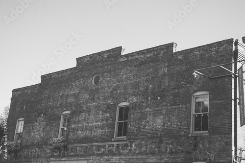 Basic Rundown Exterior Brick Building in Black and White