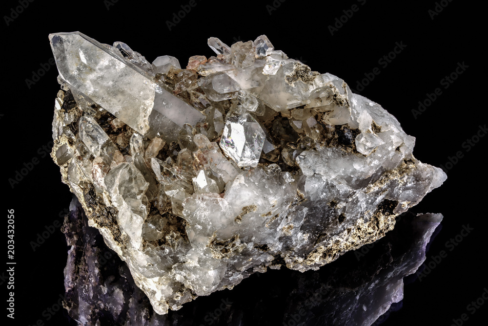 Beautiful piece of quartz crystal isolated on the black background Beautiful piece of quartz crystal isolated on the black background