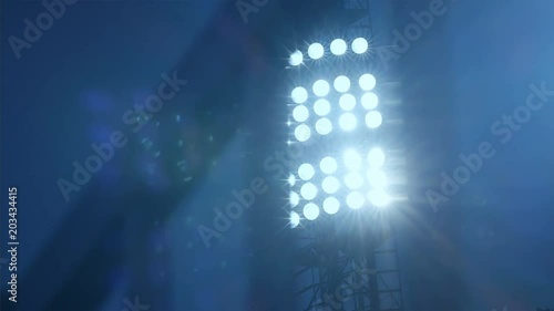 Background of football/soccer/sports stadium lights agains dark sky, 4k