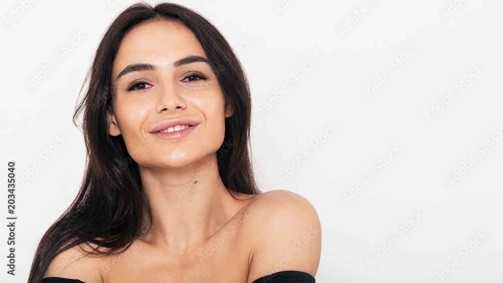 Close up of a smiling woman over white background Close up of a smiling woman over white background