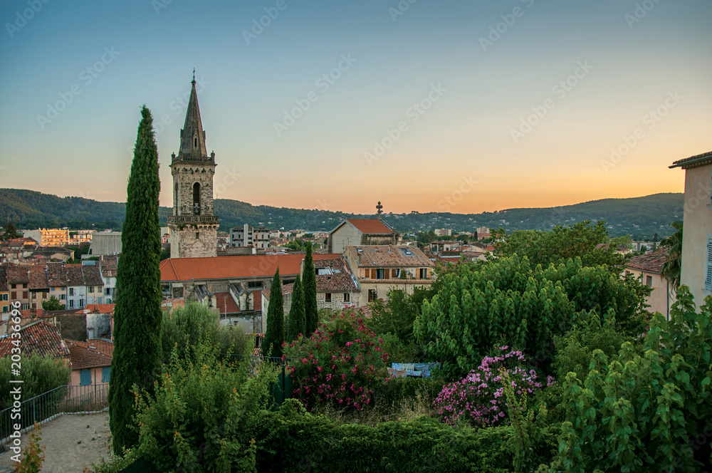 View of the graceful town of Draguignan from the hill of the clock tower under the colorful light of the sunset. Located in the Provence region, Var department, southeastern France