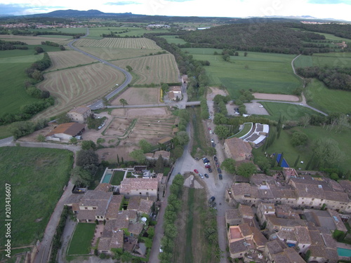 Drone en Monells, pueblo del Emporda en Gerona, Costa Brava (Cataluña,España). Fotografia aerea con Dron.