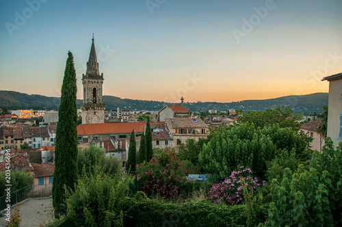 View of the graceful town of Draguignan from the hill of the clock tower under the colorful light of the sunset. Located in the Provence region, Var department, southeastern France