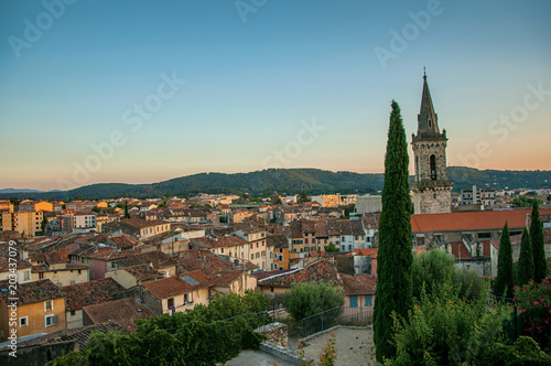 View of the graceful town of Draguignan from the hill of the clock tower under the colorful light of the sunset. Located in the Provence region, Var department, southeastern France