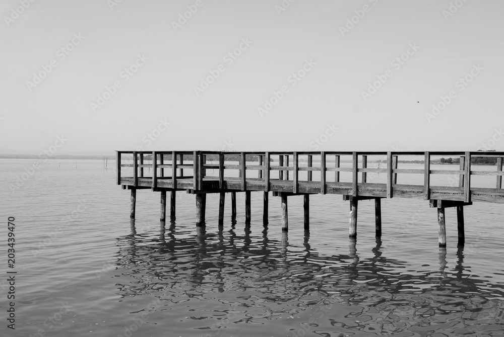 Typical old wooden pier of Passignano on the Trasimeno lake