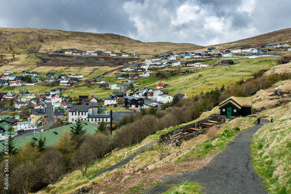 Naklejka premium Vestmanna, Faroe Islands, Denmark, in North Atlantic. Beautiful landscape. The city in the mountains. Springtime, 04.2018.