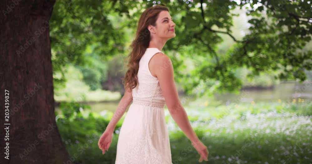 Attractive white female enjoying herself in peaceful nature setting Attractive white female enjoying herself in peaceful nature setting