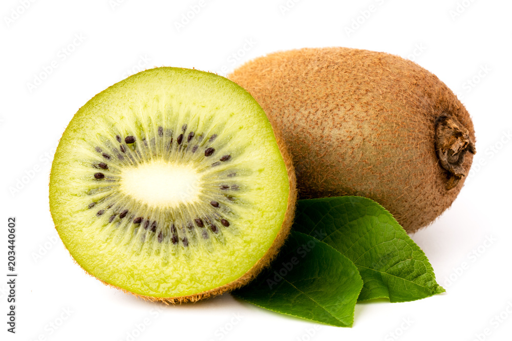 Obraz premium Ripe kiwi and half with leaves on a white. isolated
