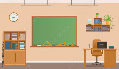 School classroom with chalkboard, clock and teacher's desk. School class room interior design. photo