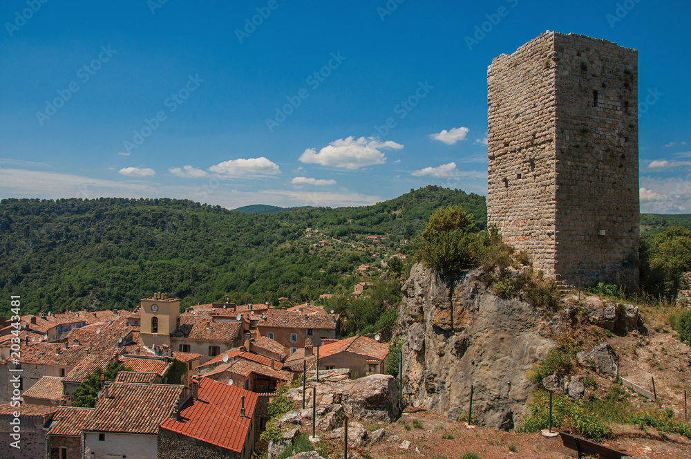 Panoramic view of tower on top of hill with Chateaudouble underneath, a quiet and tourist village with medieval origin. Located in the Var department, Provence region, southeastern France