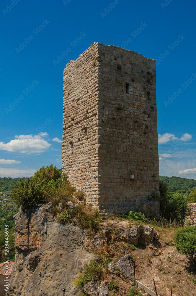 Panoramic view of tower on top of hill with the Chateaudouble village underneath, a quiet and tourist village with medieval origin. Located in the Var department, Provence region, southeastern France