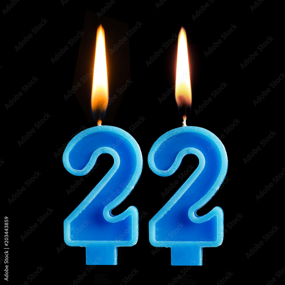 Burning birthday candles in the form of 22 twenty two for cake isolated on black background. The concept of celebrating a birthday, anniversary, important date, holiday Burning birthday candles in the form of 22 twenty two for cake isolated on black background. The concept of celebrating a birthday, anniversary, important date, holiday