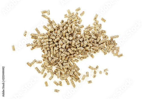 Pile of compound feed pellets isolated on a white background. Top view.