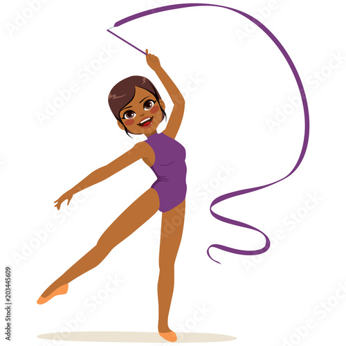 Beautiful African American professional rhythmic gymnastics woman wearing purple leotard performing with ribbon apparatus